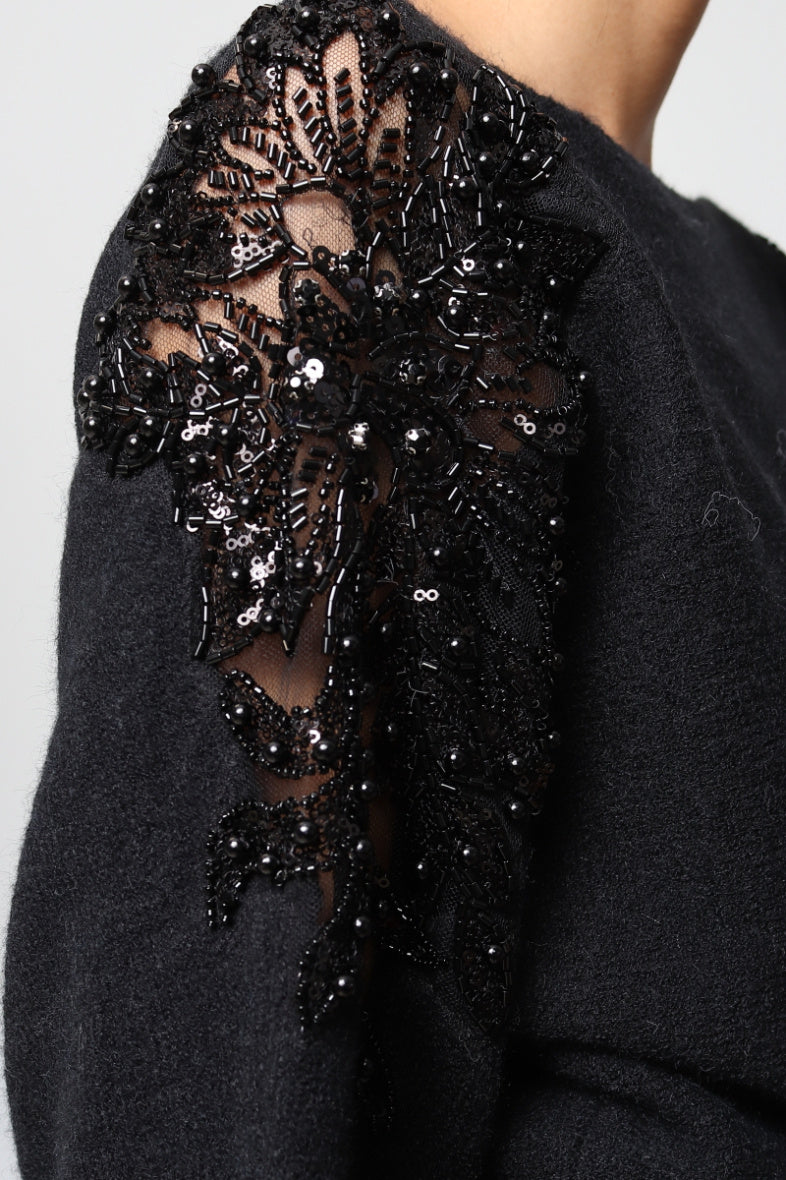 Oversized sweater with rhinestone embroidery
